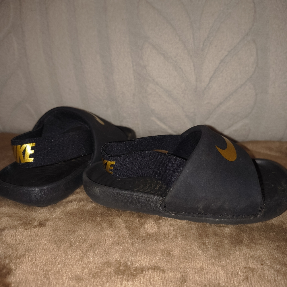 Nike Kids Black Sandals with Gold Accents